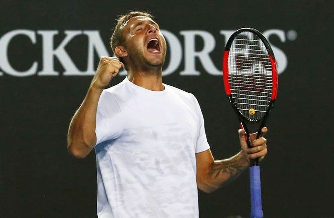Britain's Daniel Evans celebrates winning his men's singles second round match against Croatia's Marin Cilic at the Australian Open on Wednesday