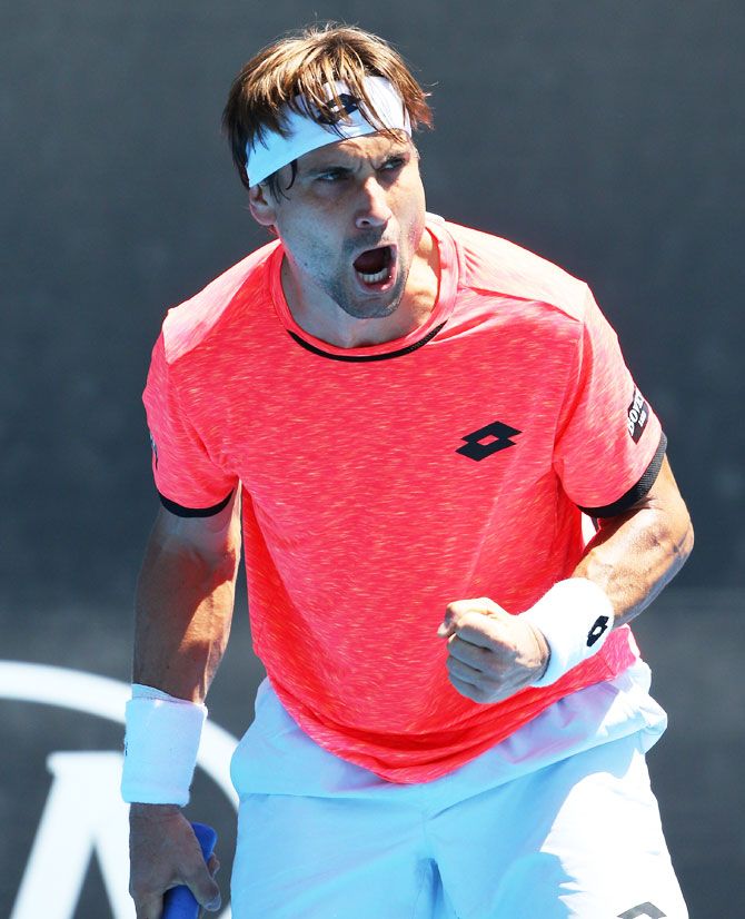 David Ferrer of Spain celebrates a point in his second round match against USA's Ernesto Escobedo