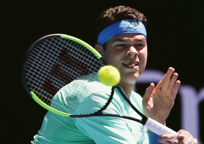 Canada's Milos Raonic hits a shot during his men's singles second round match against Luxembourg's Gilles Muller at the Australian Open in Melbourne on Thursday