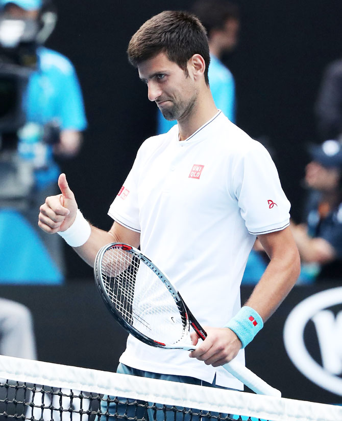 Novak Djokovic congratulates Denis Istomin after the match