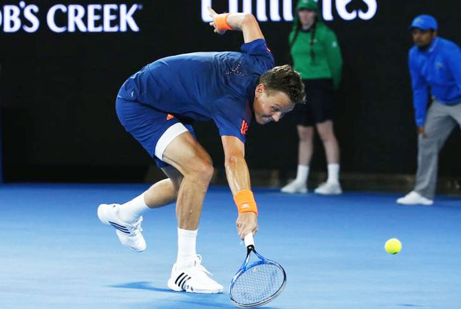 Tomas Berdych reaches for a shot during his third round match against Roger Federer