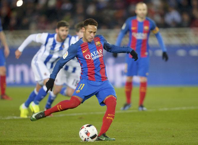 Neymar converts a penalty to score Barcelona's first goal against Real Sociedad during their King's Cup match on Thursday