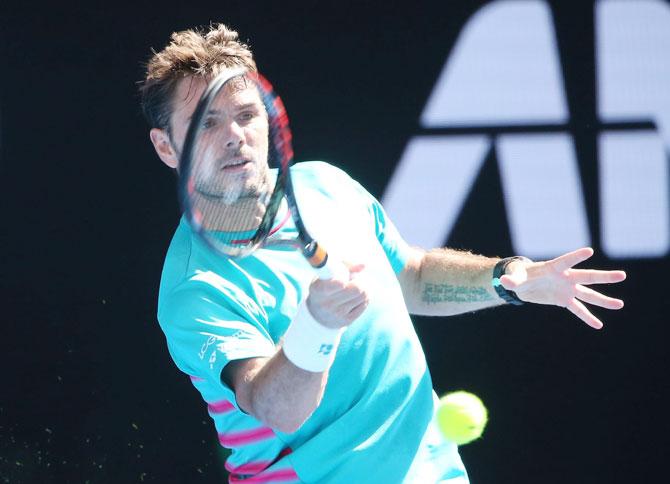 Switzerland's Stan Wawrinka plays a forehand in his third round match against Serbia's Viktor Troicki