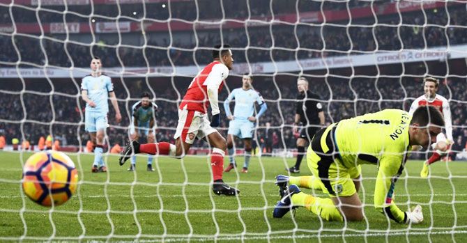 Arsenal's Alexis Sanchez scores their second goal from the penalty spot during their EPL match against Burnley on Sunday