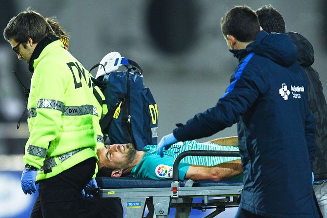 FC Barcelona's Sergio Busquets leaves the pitch on a stretcher after being injured during the La Liga match against SD Eibar on Sunday