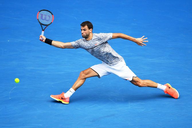 Grigor Dimitrov plays a forehand against Denis Istomin