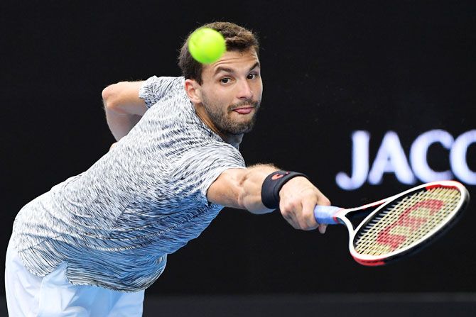 Bulgaria's Grigor Dimitrov plays a backhand in his fourth round match against Uzbekistan's Denis Istomin on day eight of the 2017 Australian Open at Melbourne Park on Monday