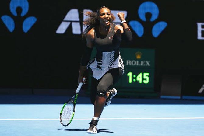 Serena Williams of the US celebrates winning her fourth round match against Czech Republic's Barbora Strycova