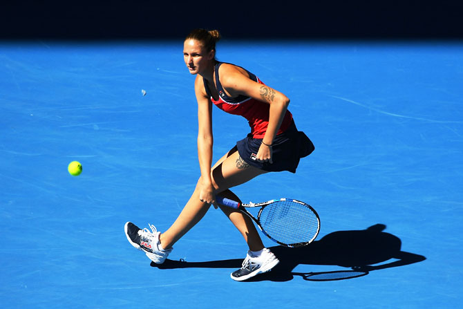 Karolina Pliskova plays a forehand return against Mirjana Lucic-Baroni