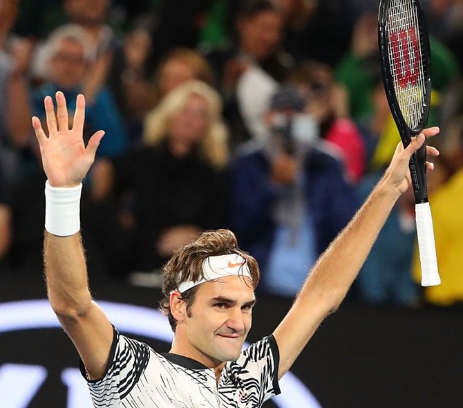 Roger Federer of Switzerland celebrates winning his semi-final match against Stanislas Wawrinka
