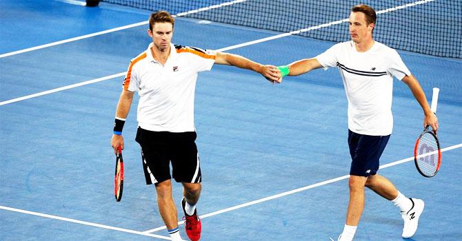 Henri Kontinen and John Peers celebrate a point en route their Australian Open men’s double title at Melbourne Park on Saturday