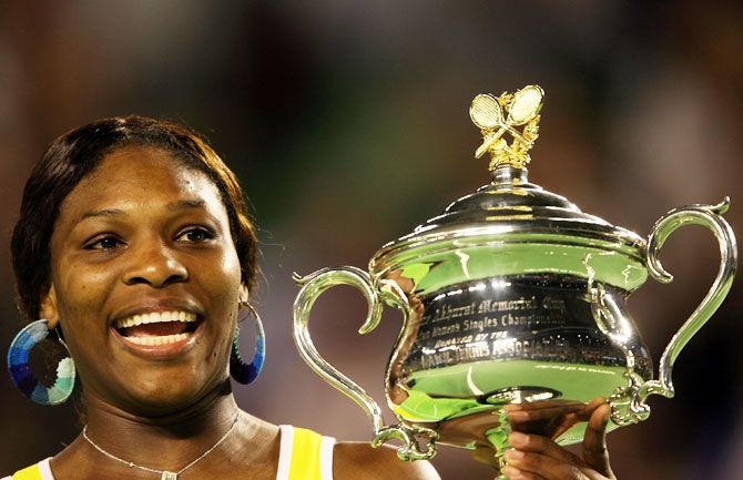 Serena Williams poses with the trophy after defeating Maria Sharapova to win the Australian Open title at Melbourne Park on January 27, 2007