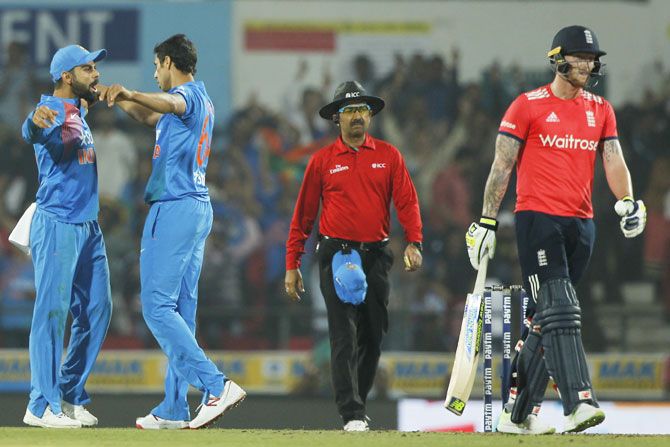 Ashish Nehra and Virat Kohli celebrate Ben Stokes' wicket in a T20 game, January 2017. Photograph: BCCI
