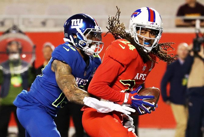 Stephon Gilmore #24 of the AFC intercepts the ball in the endzone as Odell Beckham Jr #13 of the NFC defends in the first half during the NFL Pro Bowl at the Orlando Citrus Bowl in Orlando, Florida, on Monday