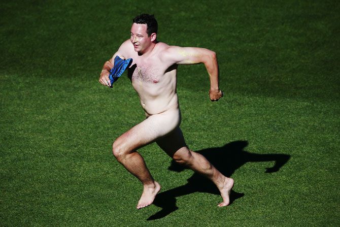 A streaker invades the field during the first One-Day International between New Zealand and Australia at Eden Park in Auckland on Monday. The hosts won the match by 6 runs