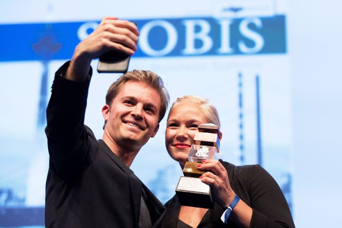 Paralympics gold medalist Vanessa Low and former Formula 1 driver and current world champion Nico Rosberg take a selfie after the former received the 'Keep Fighting Award' during a German business summit, SpoBis, in Duesseldorf, Germany, on Monday. The 'Keep Fighting Award' was launched by Michael Schumacher's family for charitable purposes
