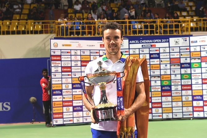 Spain's Roberto Bautista Agut with the Chennai Open trophy on Sunday