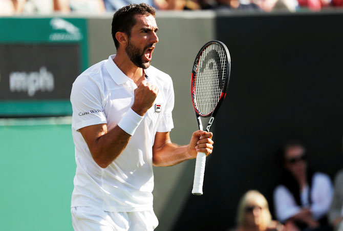 Croatia’s Marin Cilic celebrates winning the first round match against Germany’s Philipp Kohlschreiber