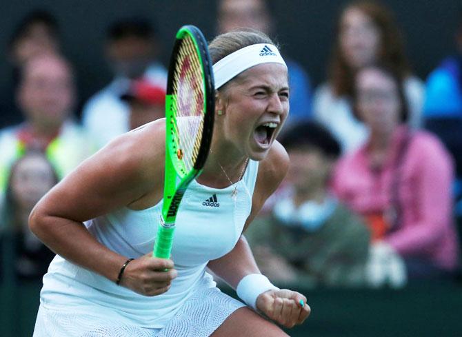 Latvia’s Jelena Ostapenko celebrates winning her first round match against Belarus’ Aliaksandra Sasnovich