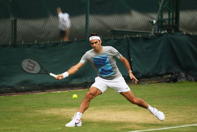 Roger Federer goes through the paces during a training session at Wimbledon on Saturday