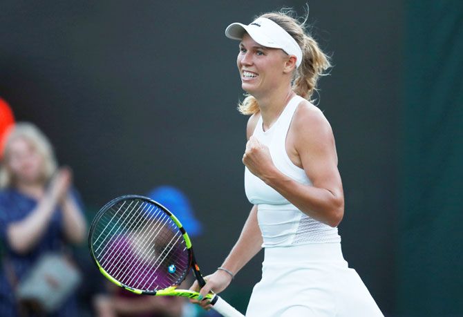 Denmark’s Caroline Wozniacki celebrates winning the second round match against Bulgaria’s Tsvetana Pironkova