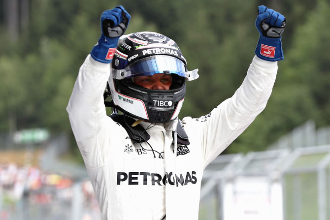 Mercedes GP's Finnish driver Valtteri Bottas celebrates his win in parc ferme during the Formula One Grand Prix of Austria at Red Bull Ring in Spielberg, Austria, on Sunday