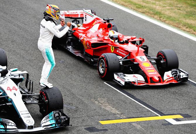 Great Britain and Mercedes GP's Lewis Hamilton celebrates finishig on pole position during qualifying for the Great Britain Formula One Grand Prix at Silverstone in Northampton, England, on Saturday