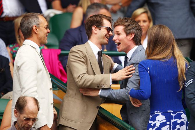 Actors Eddie Redmayne and Andrew Garfield joke from the centre court royal box prior to the men’s singles final between Roger Federer and Marin Cilic on Sunday