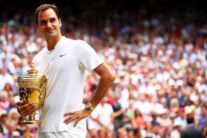 Switzerland's Roger Federer celebrates victory with the trophy after beating Croatia's Marin Cilic to win the WimbledonSwitzerland's Roger Federer celebrates victory with the trophy after beating Croatia's Marin Cilic to win the Wimbledon