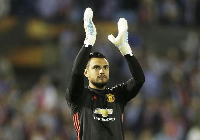 Manchester United's keeper Sergio Romero applauds