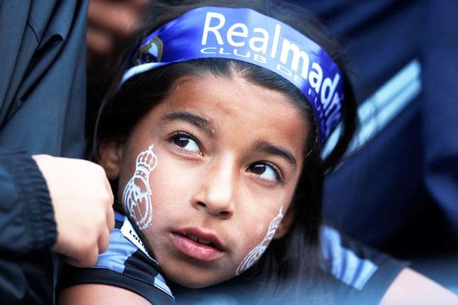 A Real Madrid fan watches in the stands during the International Champions Cup between Real Madrid and Manchester City on Wednesday