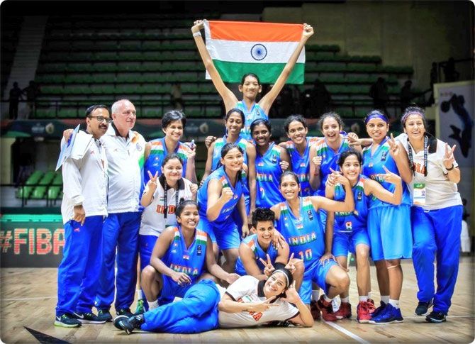 The Indian women's basketball team celebrate after winning the FIBA Women's Asia Cup in Bengaluru on Saturday