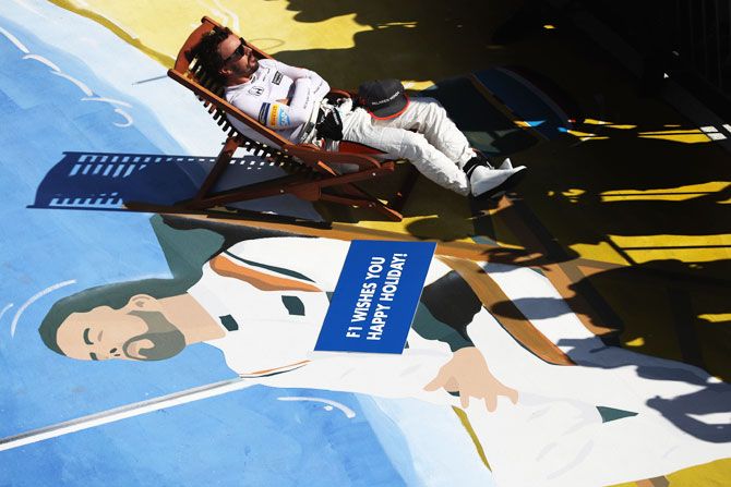 Spain and McLaren Honda's Fernando Alonso takes a seat in parc ferme at Hungaroring