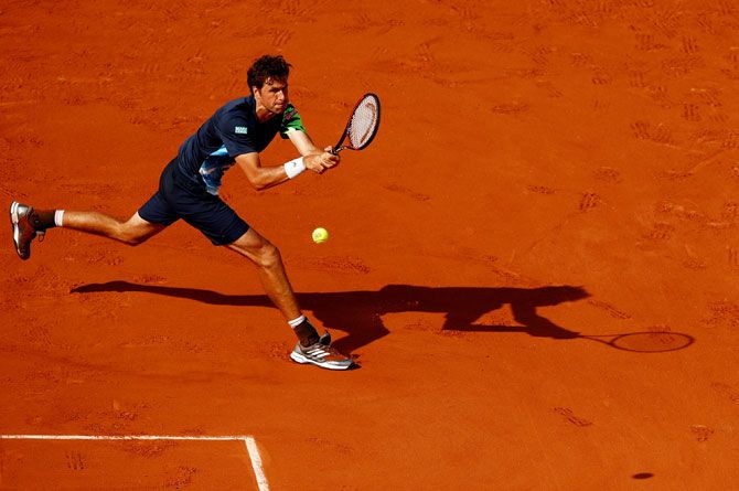 Dutchman Robin Haase hits a backhand during the second roun match against Spaniard Rafael Nadal on Wednesday