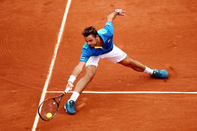 Switzerland's Stan Wawrinka  plays a forehand during the men's singles third round match against Italy's Fabio Fognini