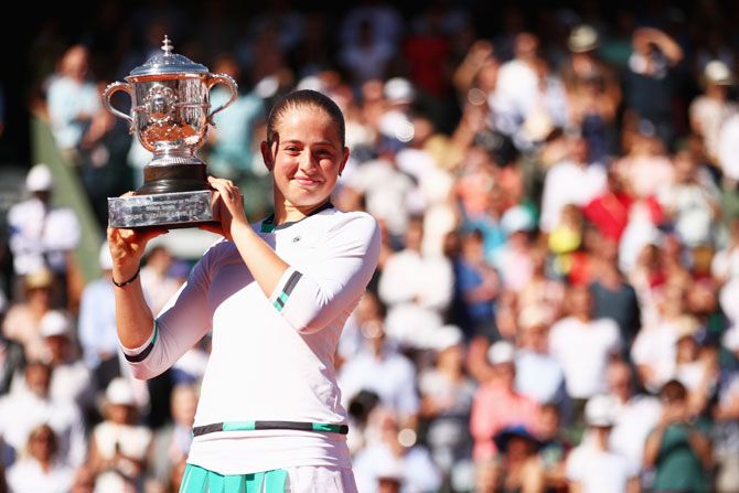 Latvia's Jelena Ostapenko with the Suzanne-Lenglen trophy following her French Open win over Romania's Simona Halep at Roland Garros in Paris on Saturday