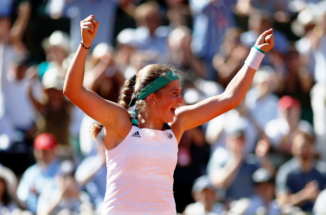 Latvia’s Jelena Ostapenko celebrates winning the French Open final against Romania’s Simona Halep