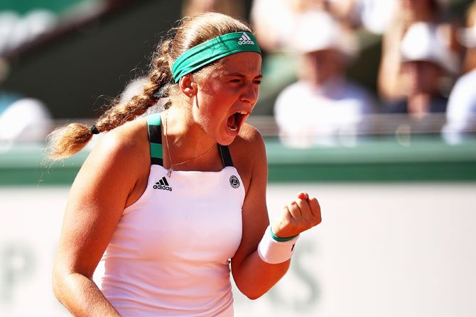 Jelena Ostapenko celebrates a point during the French Open final against Simona Halep