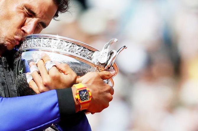 Rafael Nadal kisses the trophy after winning his 10th French Open title on Sunday