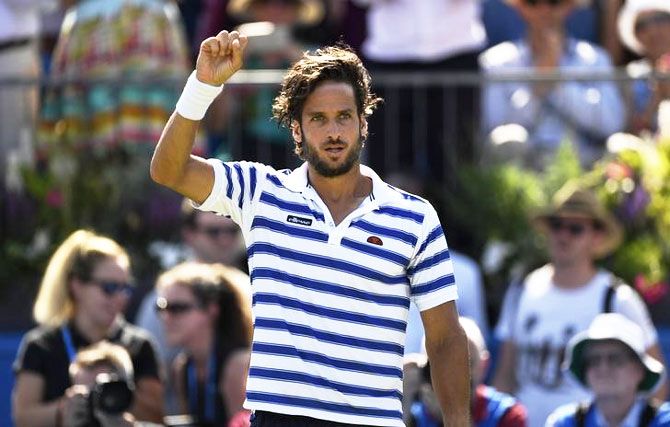Spain's Feliciano Lopez celebrates defeating Switzerland's Stan Wawrinka in the first round of the Queen's Club Aegon Championship at Queen's Club in London on Tuesday