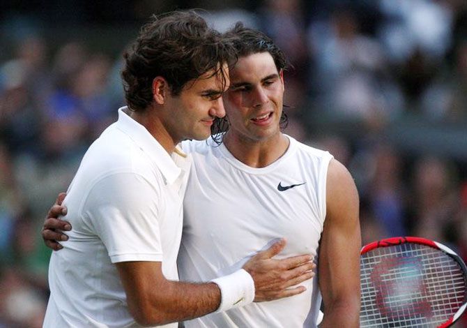 A file photograph of Rafael Nadal (right) and Roger Federer embracing at the nets after the former defeated the latter to win the Wimbledon tennis championships, on JUly 6, 2008, arguably the best tennis encounter of all time