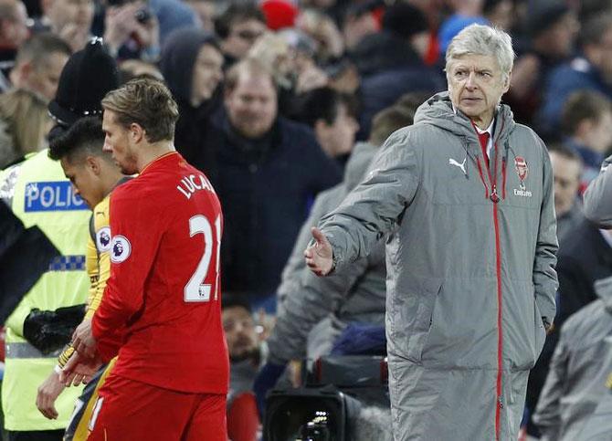 Arsenal manager Arsene Wenger, Arsenal's Alexis Sanchez and Liverpool's Lucas Leiva after the match