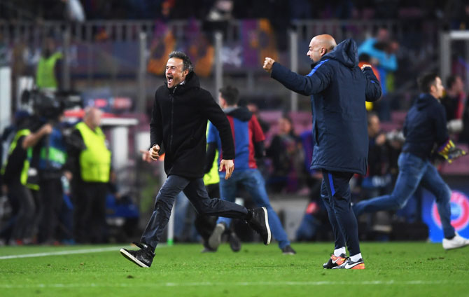 FC Barcelona (left) manager Luis Enrique celebrates as Sergi Roberto scores their sixth and winning goal on Wednesday