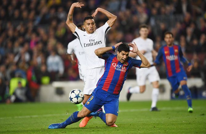 The contentious challenge by PSG's Marquinhos that saw Luis Suarez go down and earn Barca a penalty in the dying minutes of the game on Wednesday
