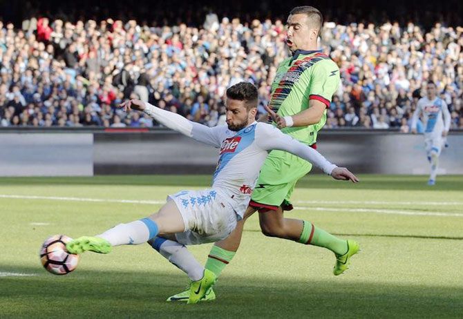 Napoli's Dries Mertens and Crotone's Noe Dussenne vie for possession during their Serie A match at San Paolo stadium, Naples, on Sunday