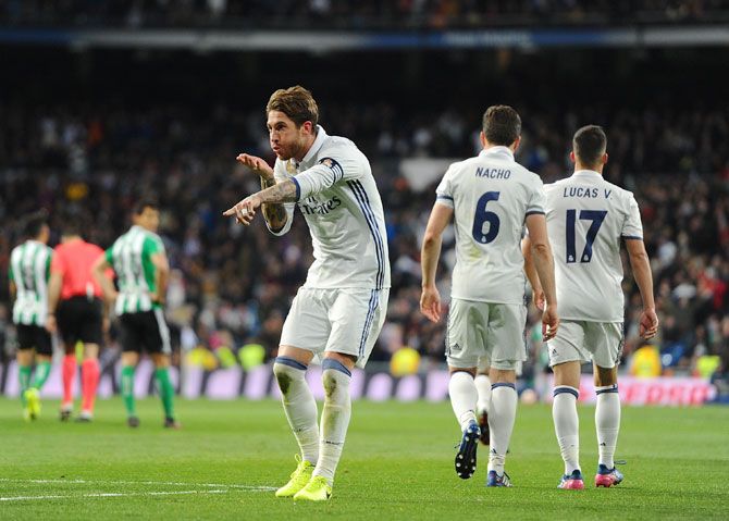 Real Madrid's Sergio Ramos celebrates after scoring the team's 2nd goal during their La Liga match against Real Betis Balompie at Estadio Santiago Bernabeu in Madrid on Sunday