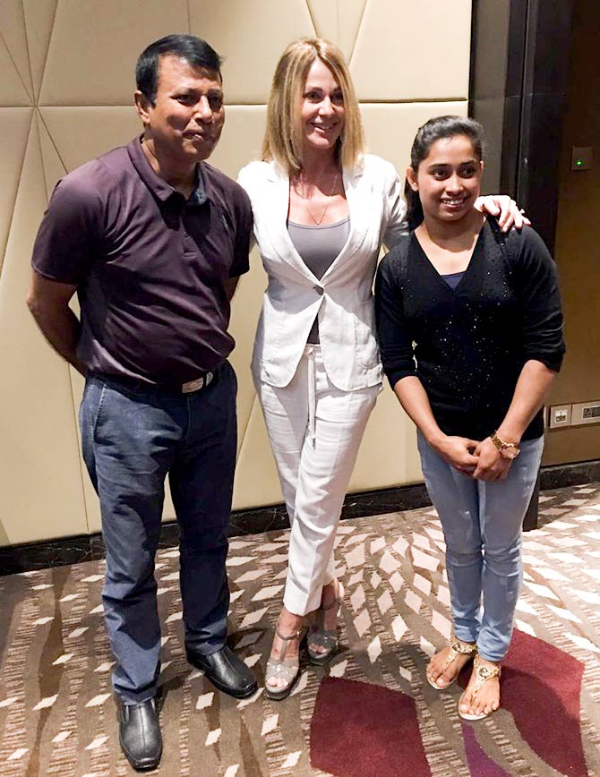 Romanian American gymnast Nadia Comaneci with Indian gymnast Dipa Karmakar and her coach Bishweshwar Nandi