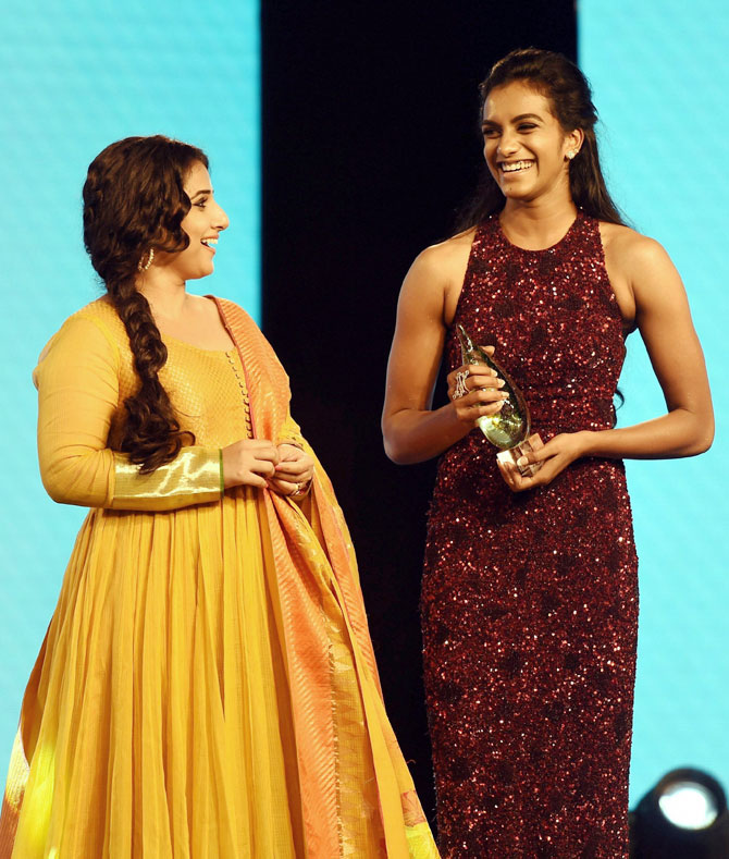 Rio Olympic gold medalist PV Sindhu is all smiles by being handed the Sportsperson of the Year award by Bollywood star Vidya Balan 