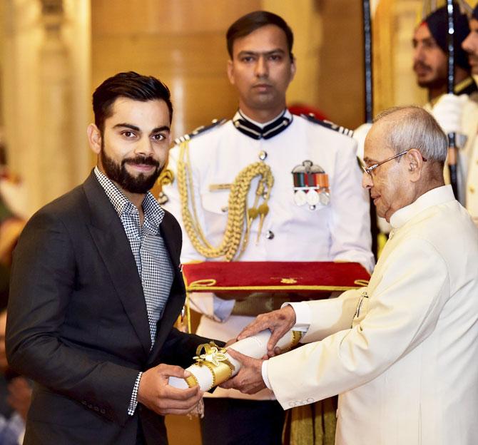 President Pranab Mukherjee presents the Padma Shri to cricketer Virat Kohli during Padma Awards 2017 function at Rashtrapati Bhavan in New Delhi on Thursday