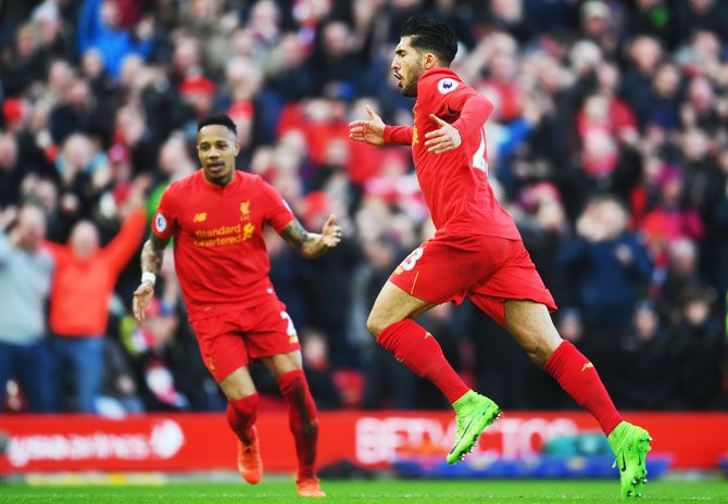 Liverpool's Emre Can (23) celebrates with Nathaniel Clyne as he as he scores their second goal against Burnley during the Premier League match at Anfield in Liverpool on Sunday